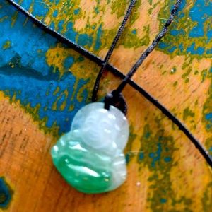 Jade Buddha Necklace On Cord.